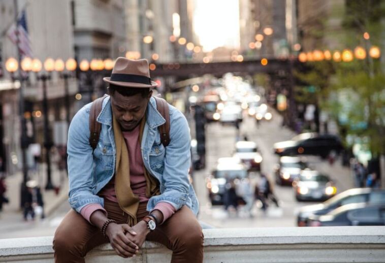 man relaxing in city