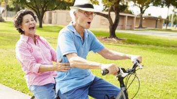 elderly couple on bike