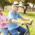 elderly couple on bike
